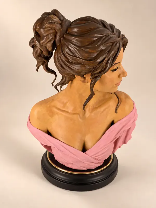 Hand-painted bust of a woman with an updo, other three-quarter view
