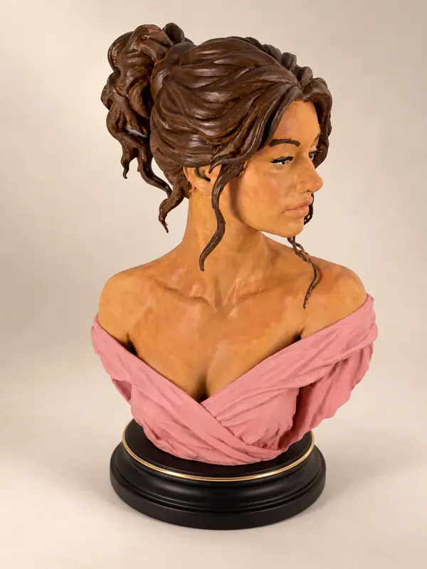 Hand-painted bust of a woman with an updo, three-quarter view